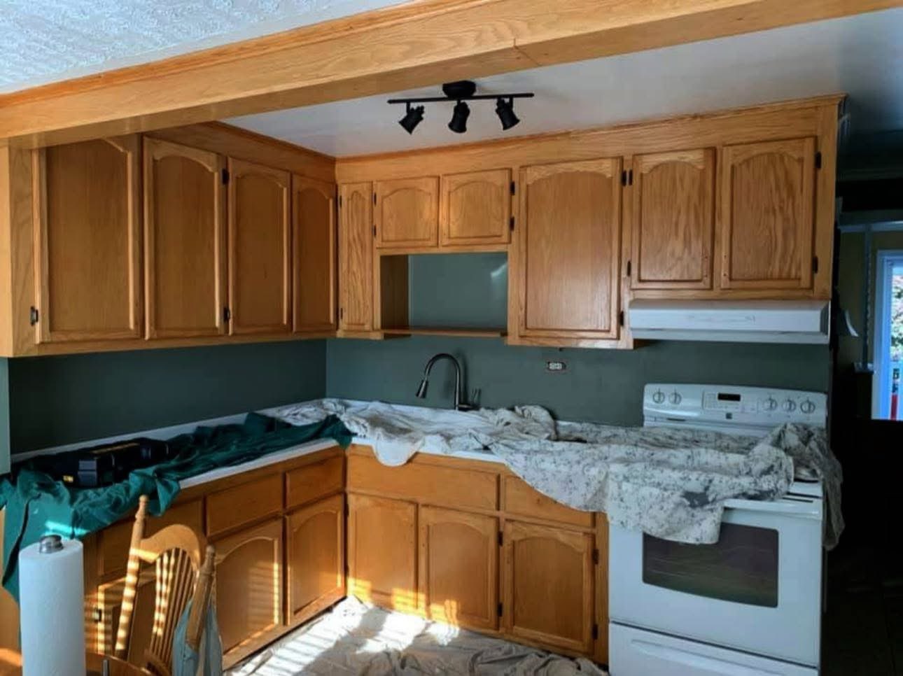 Kitchen counters and stove protected during painting