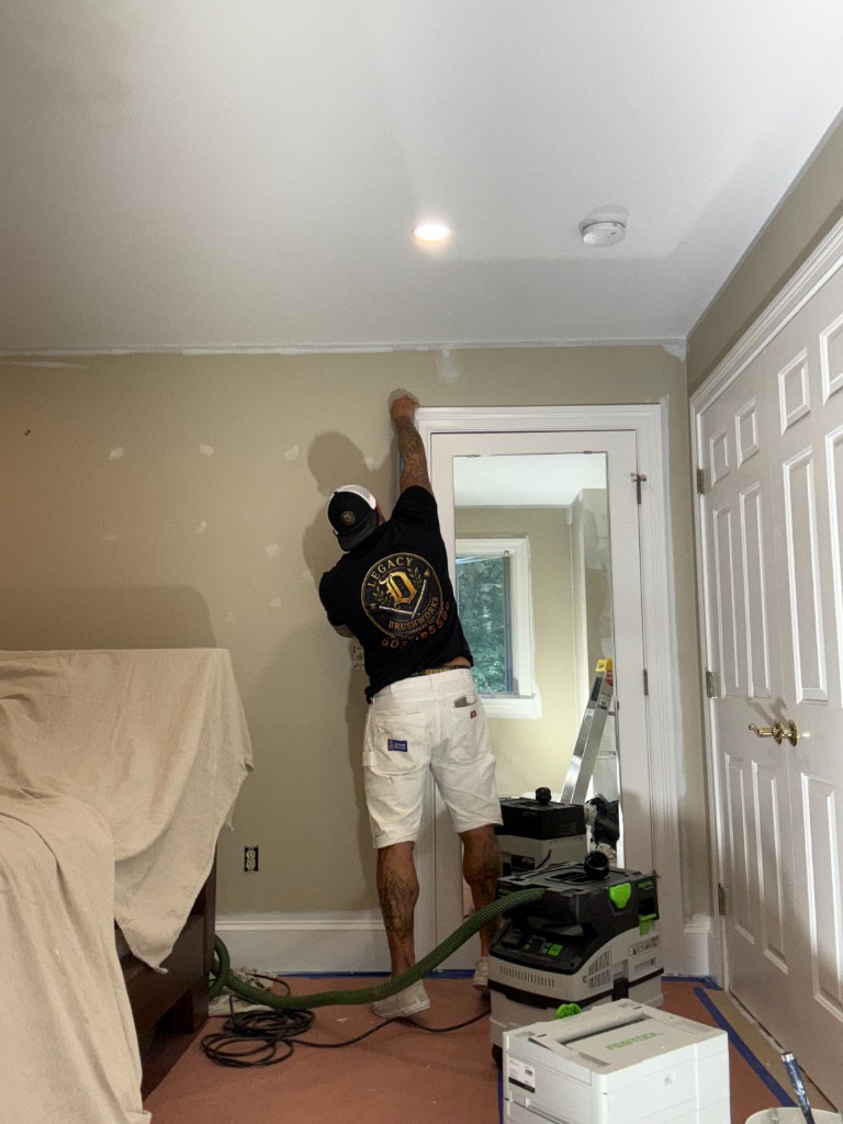 Gary Debreceni painting interior trim on a Legacy Brushworks jobsite