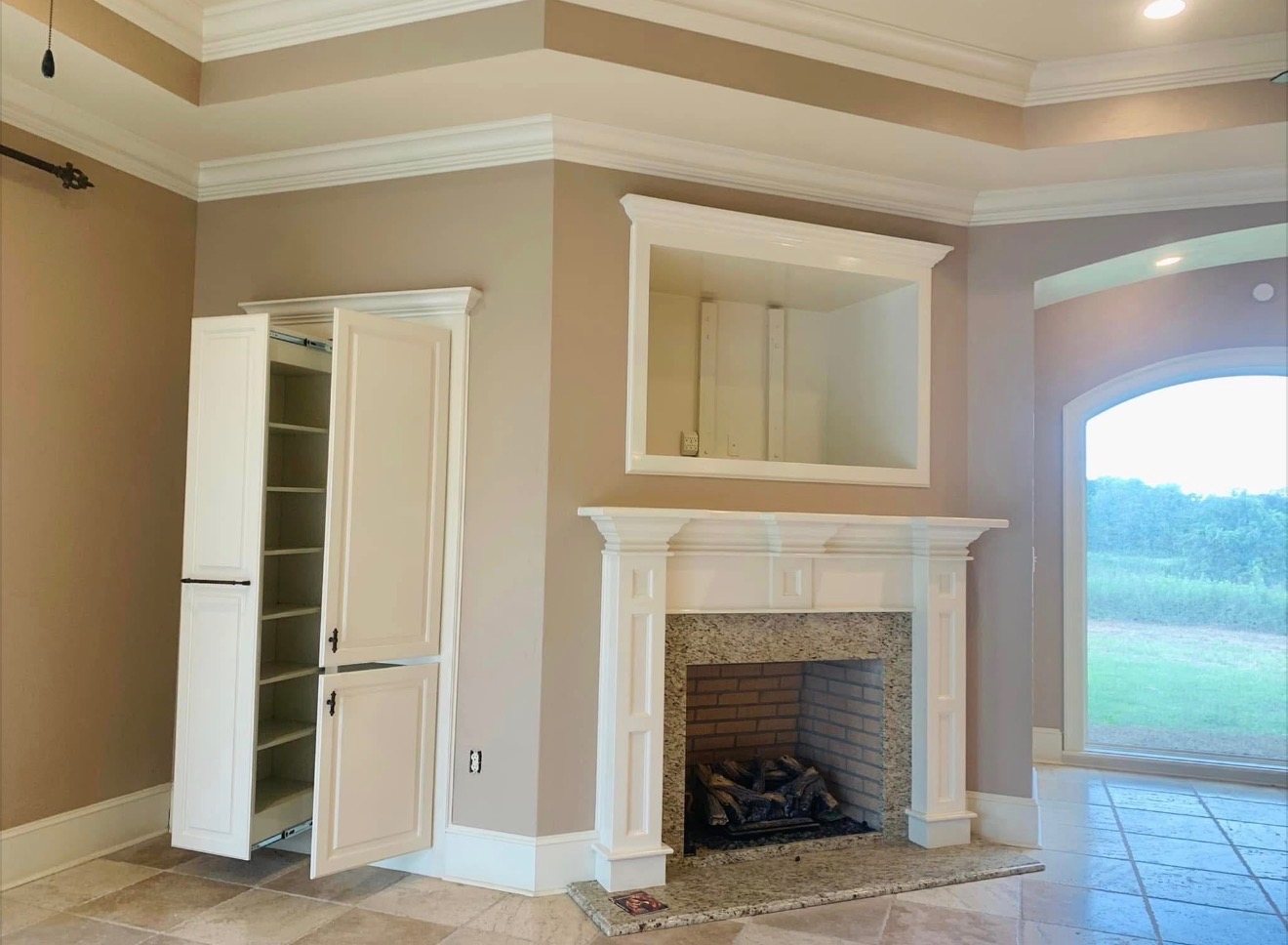 Finished fireplace wall, trim, and built-ins after painting