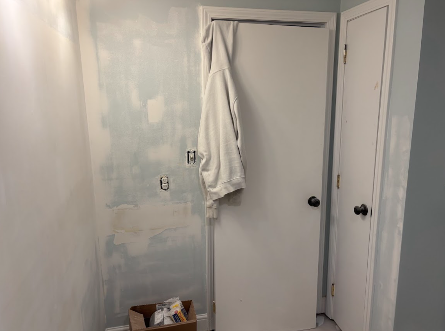 Drywall repair and wall preparation before paint