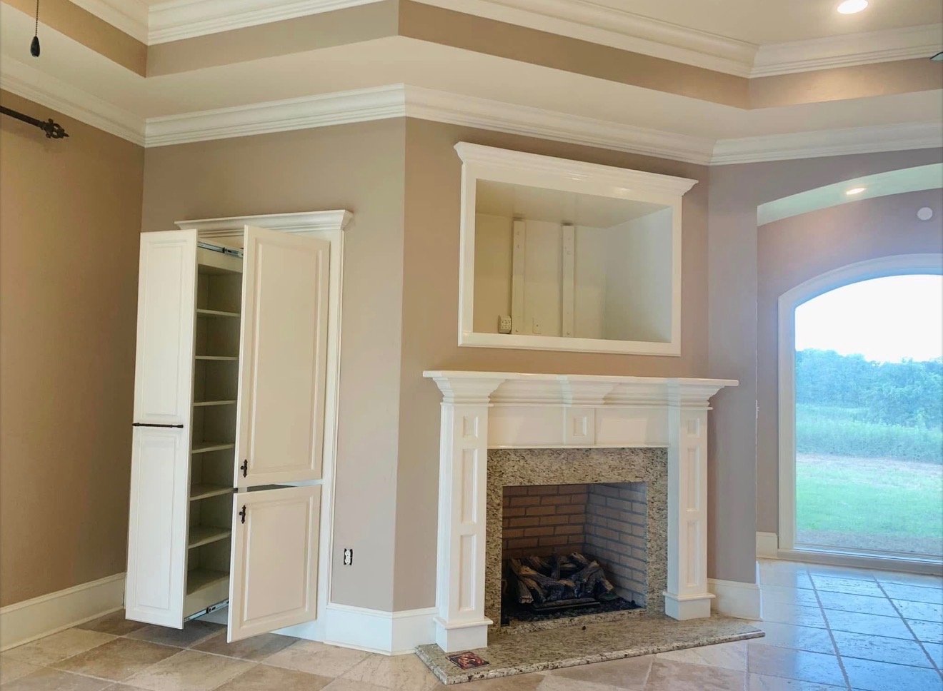Finished fireplace, mantel, and interior trim