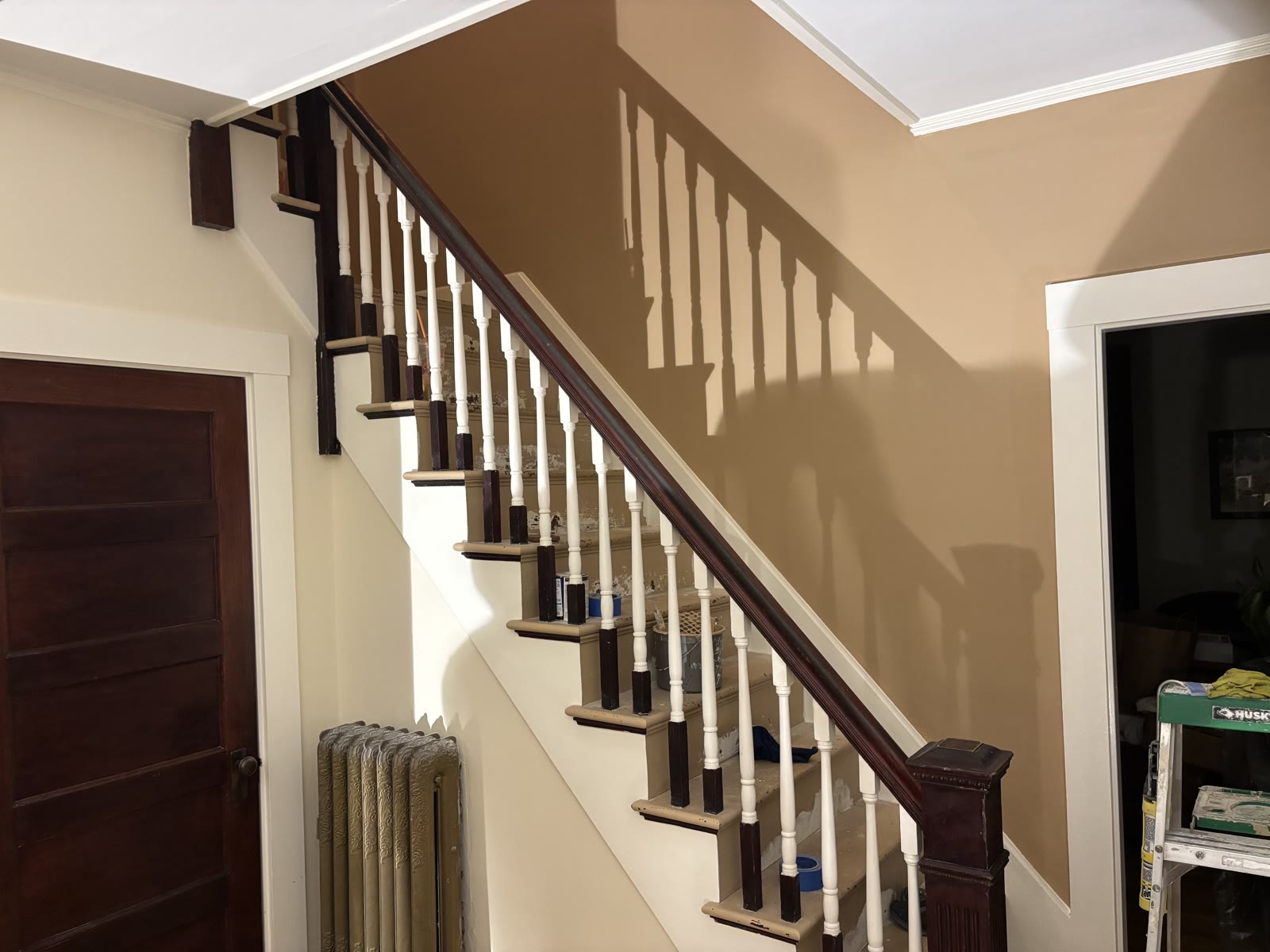 Staircase mid-project with materials staged on the treads