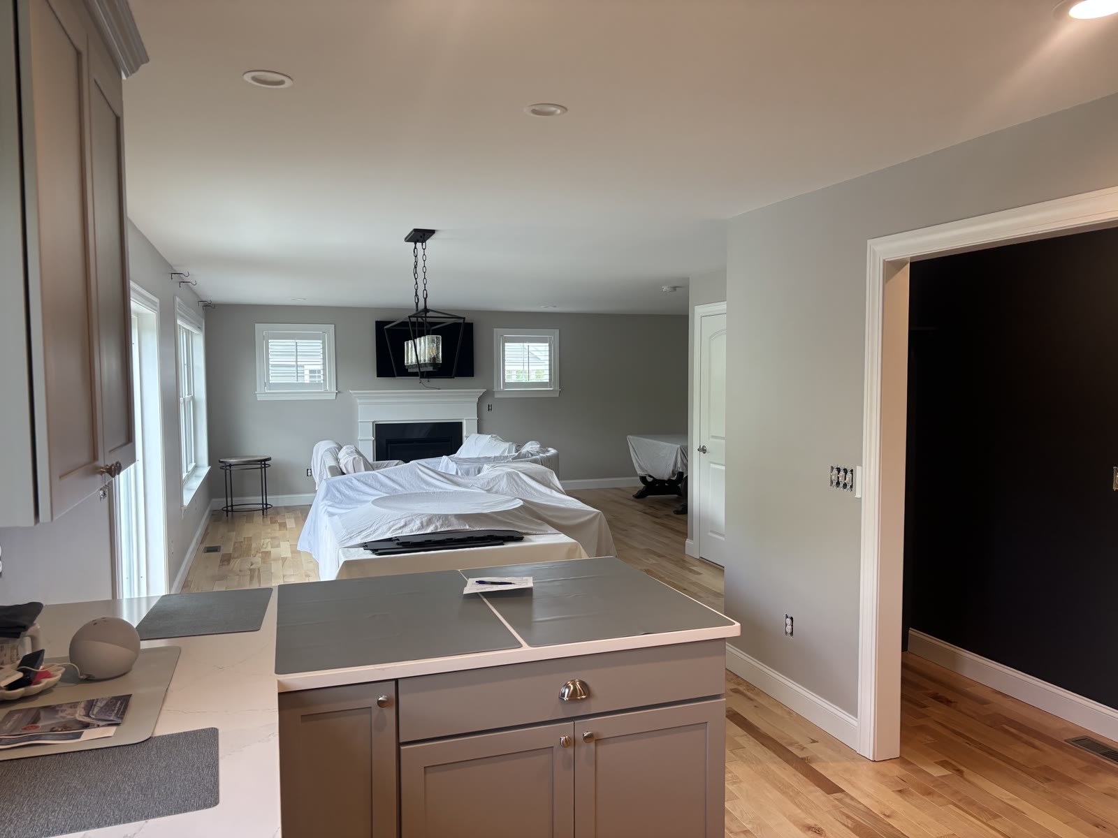 Finished open kitchen and living room with gray walls