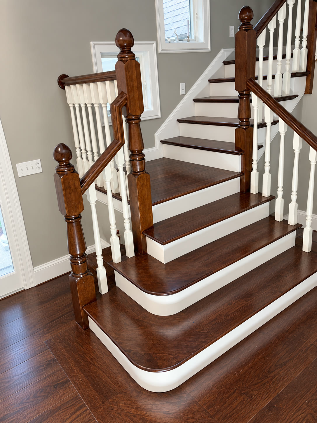 Refinished staircase newel post and balusters detail