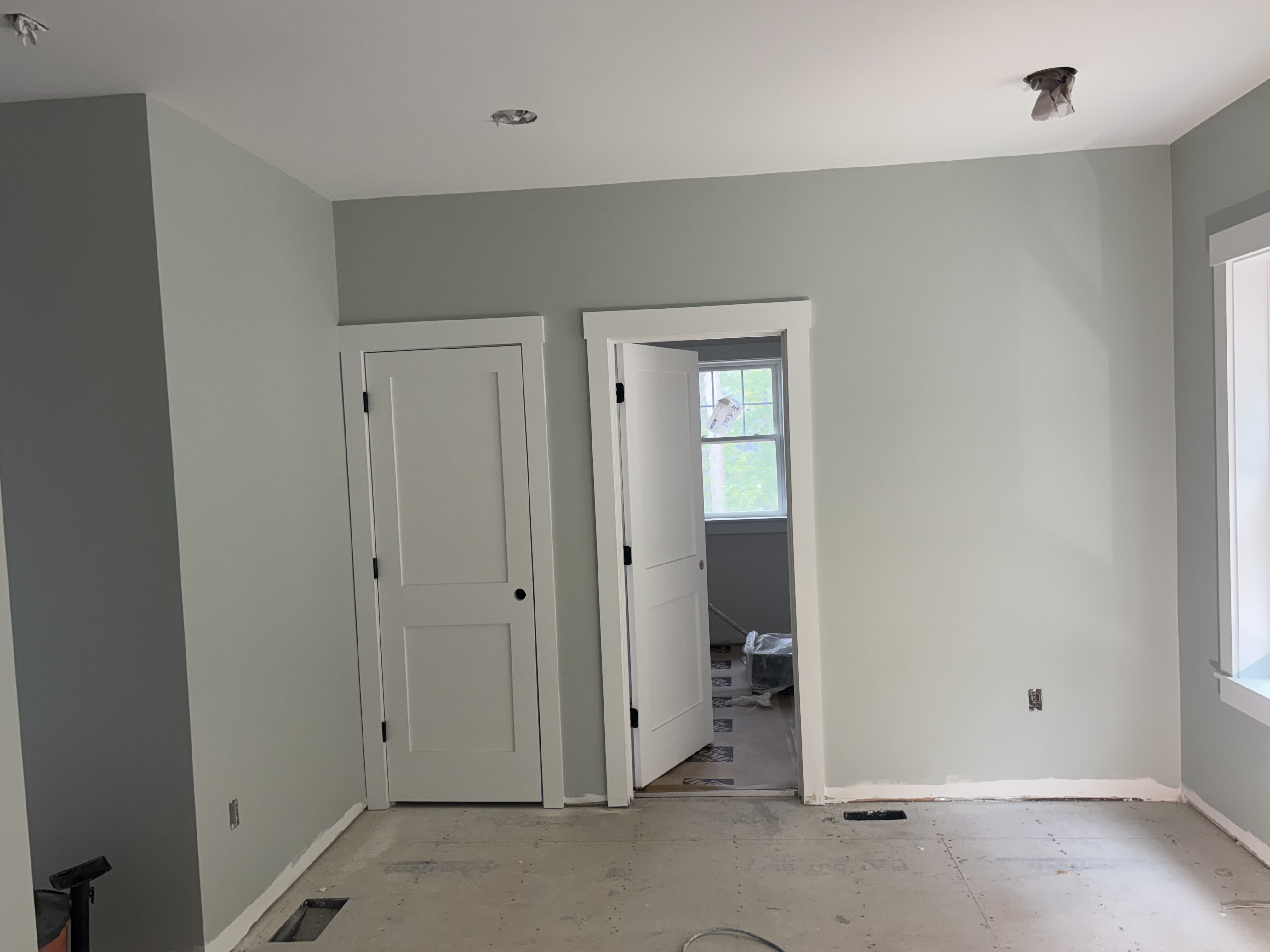 Interior walls and trim painted before floors are finished